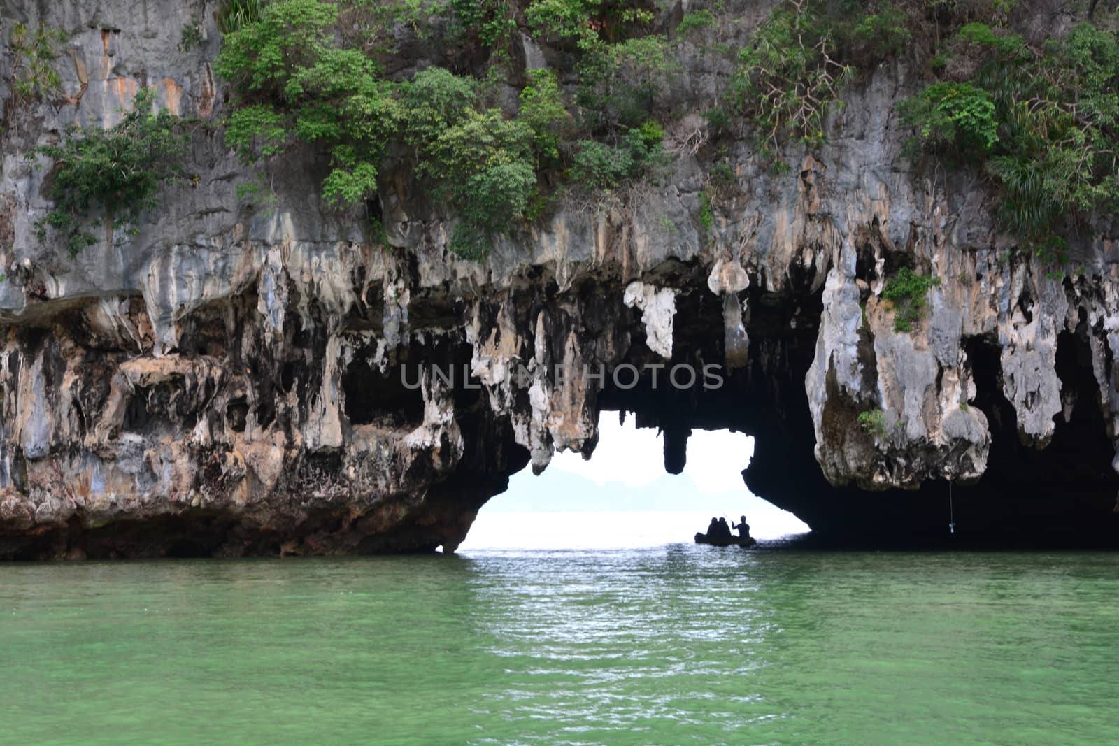 Tham Lod Yai (Grotto Cave) Jungle covered limestone cliffs at Phang Nga Bay