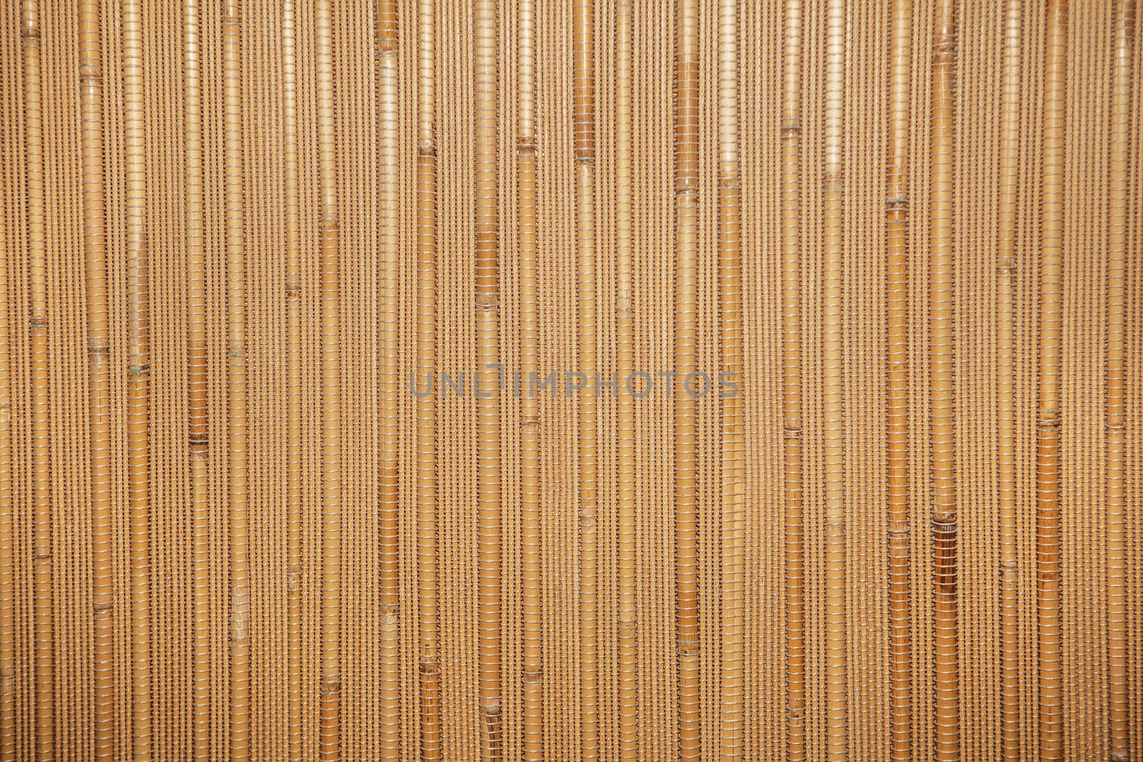Natural warm wooden background with bamboo and straw by natazhekova