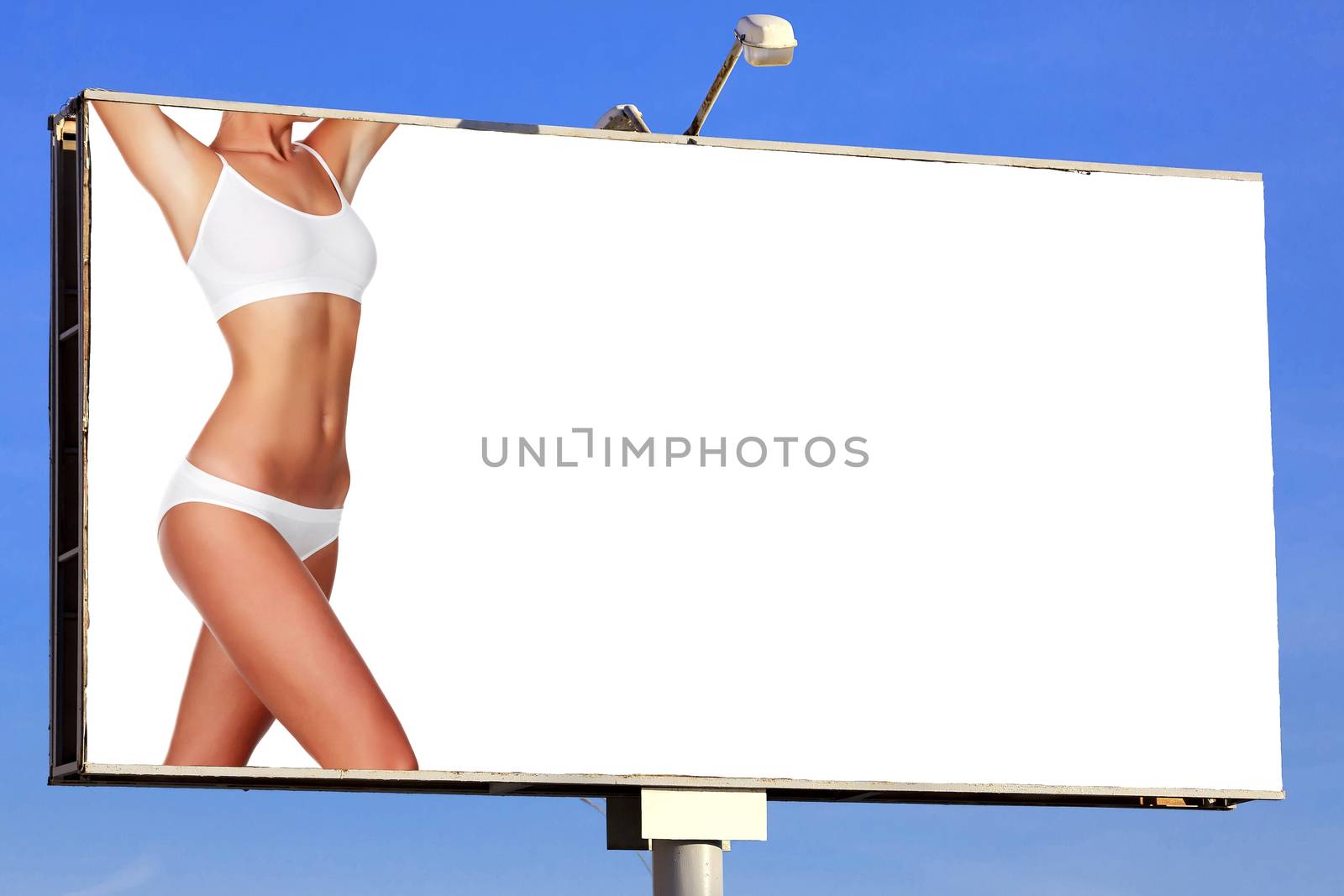 Woman body on street billboard with a space for your text