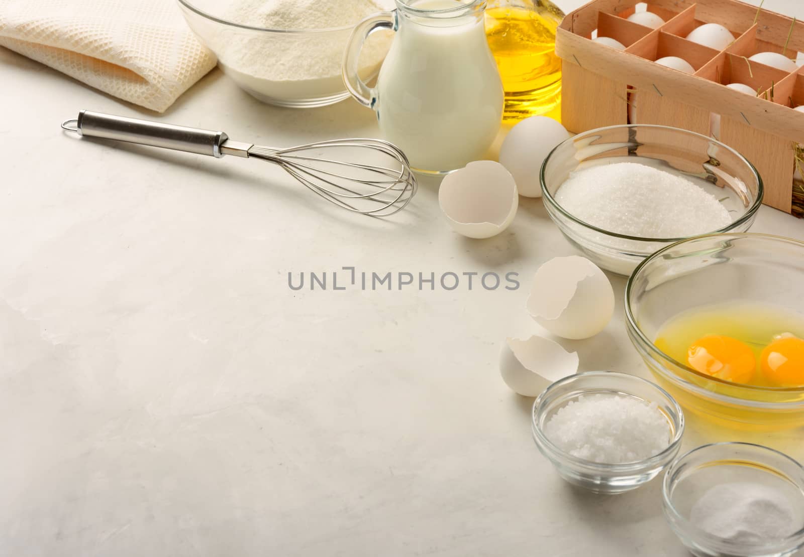 Ingredients for making pancakes on a white background. Copy space.