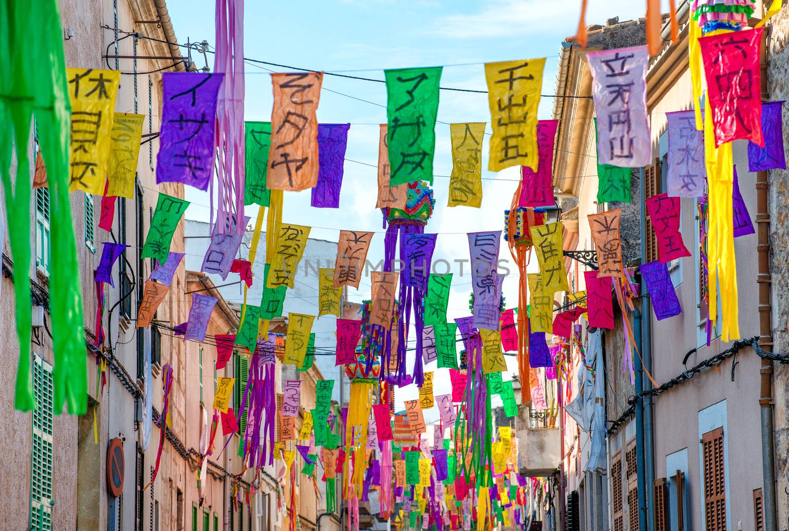 Street decorated with colorful signs.