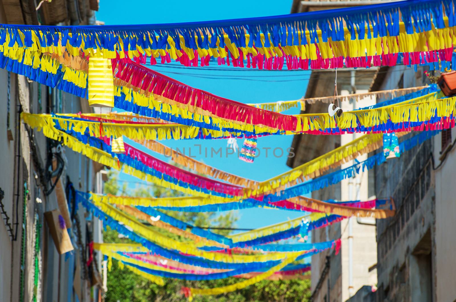 Street decorated with colorful ribbons.