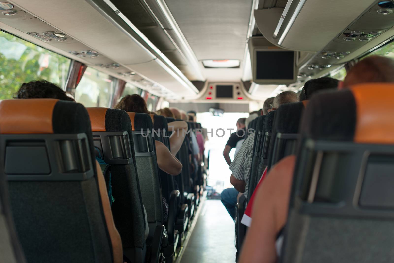 View from inside the bus with passengers.