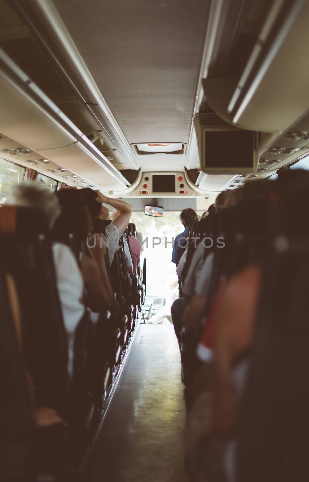 View from inside the bus with passengers.