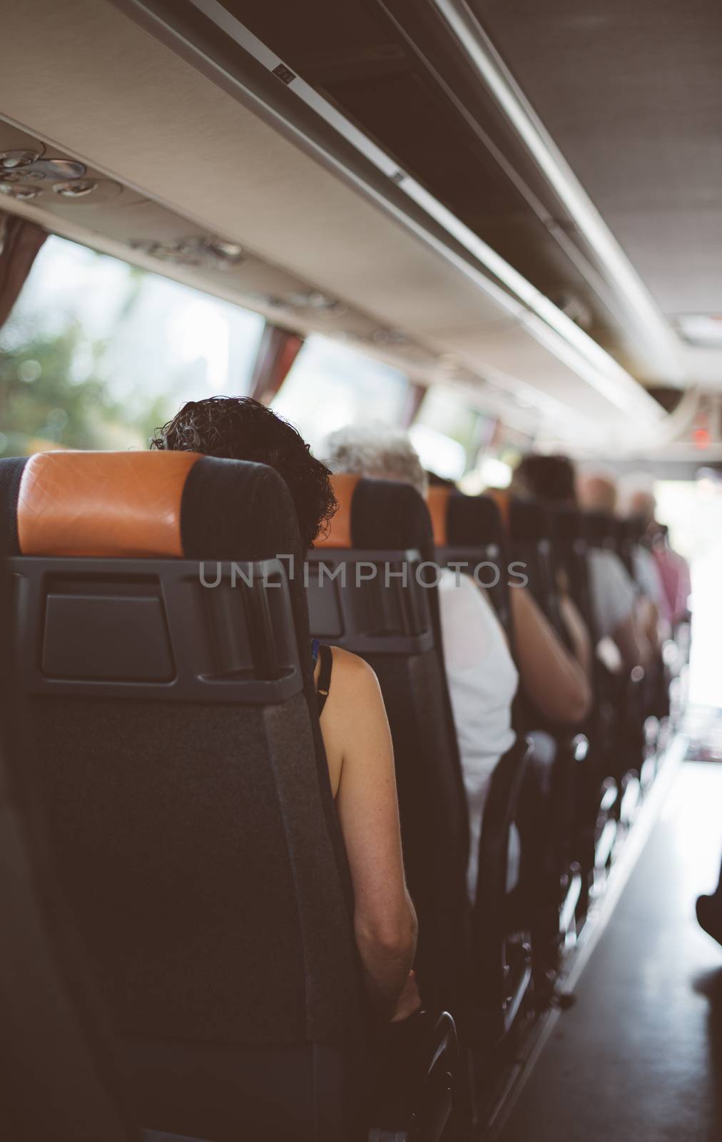 View from inside the bus with passengers.