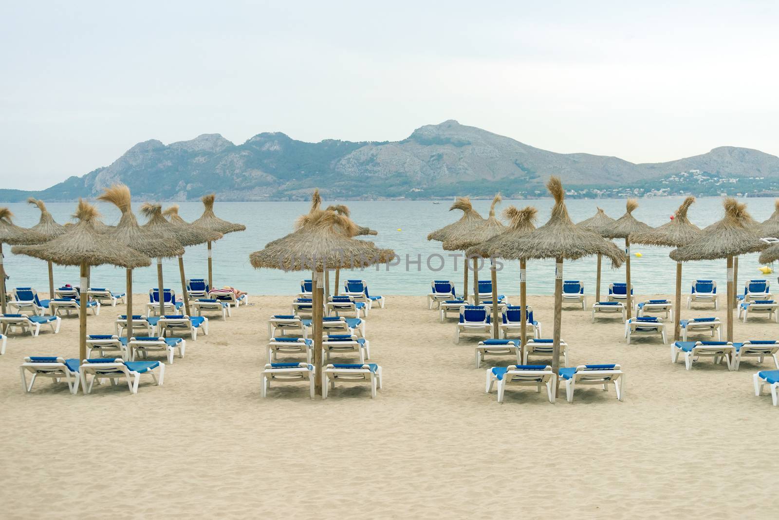 Plenty of sun loungers on the beach. by dmitrimaruta
