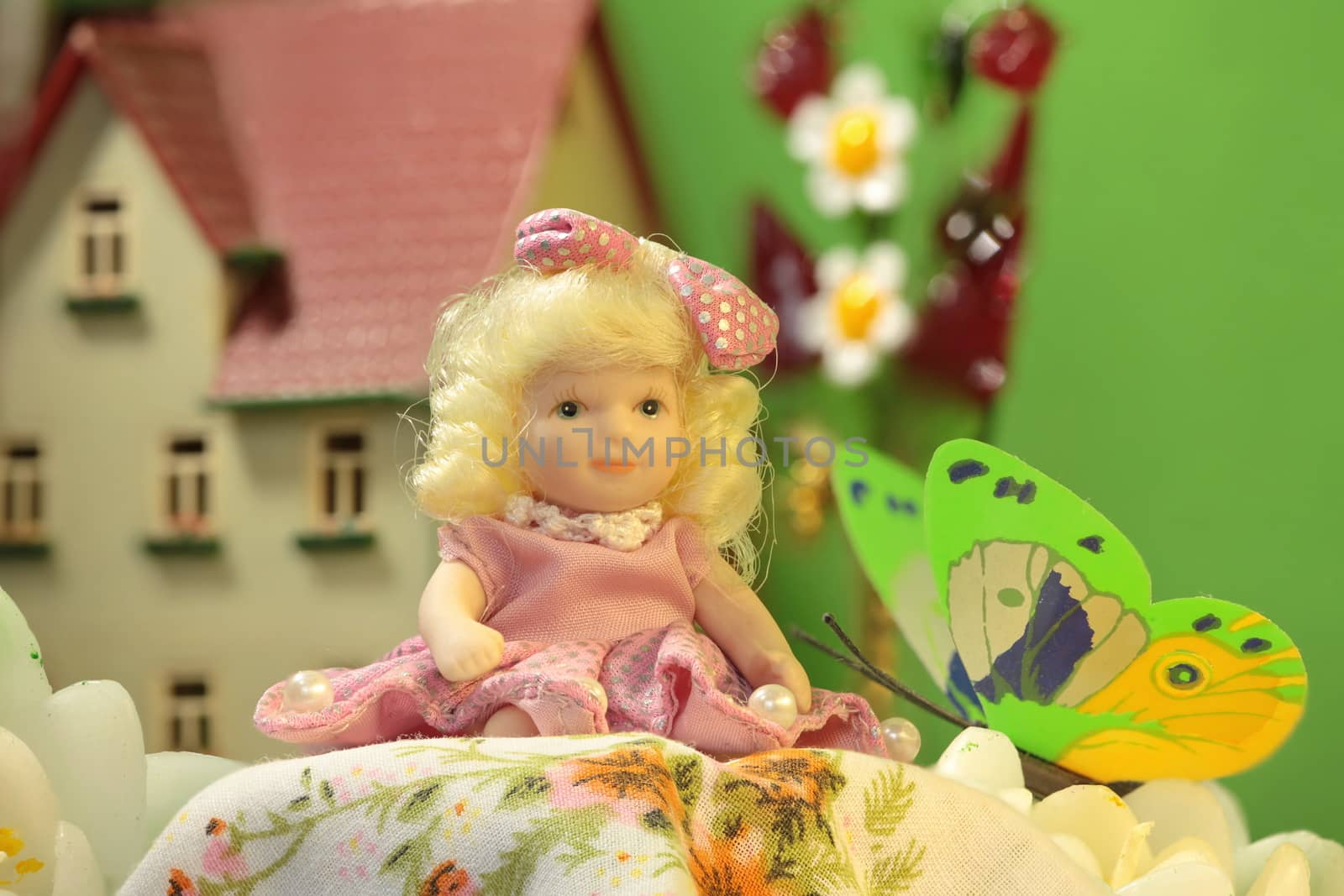 Thumbelina girl among the flowers in Puppet town