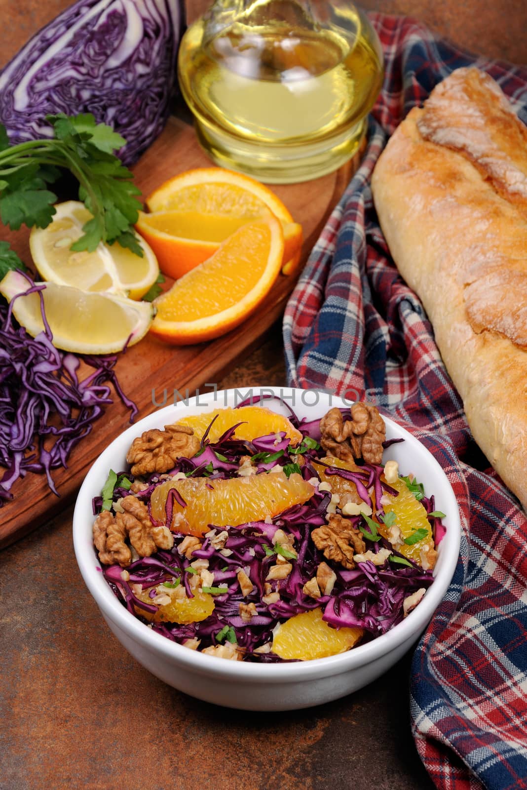 red coleslaw salad with slices of oranges and walnuts