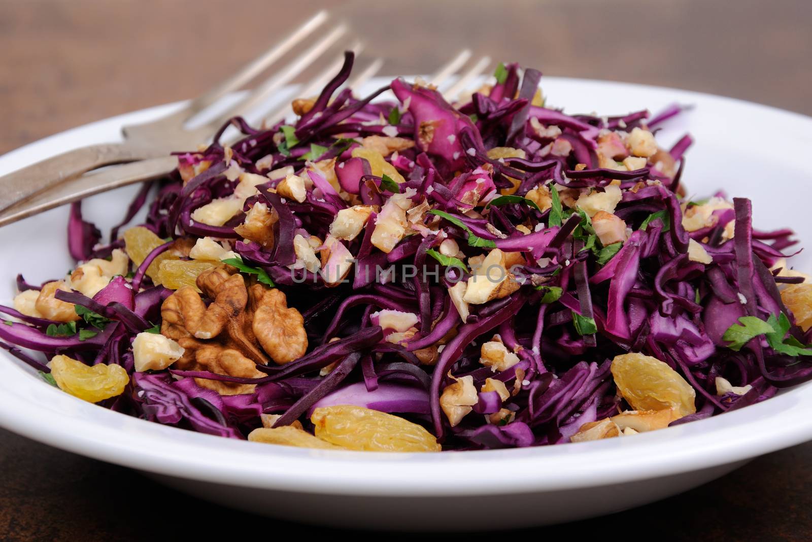 salad red coleslaw with raisins and crushed walnut
