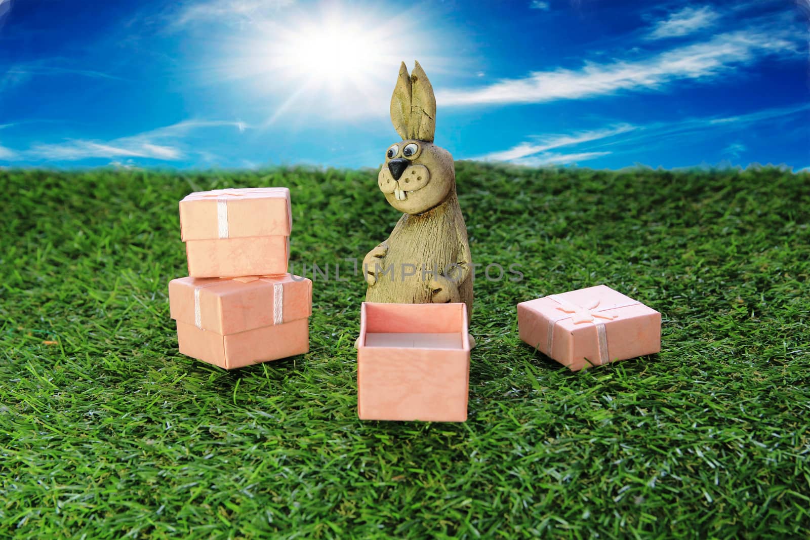 Easter. Brown Easter Bunny with pink gift box