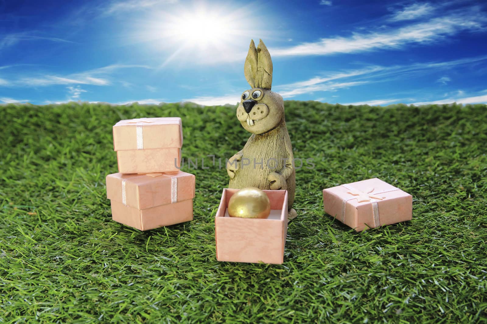 Easter. Brown Easter Bunny with pink gift box