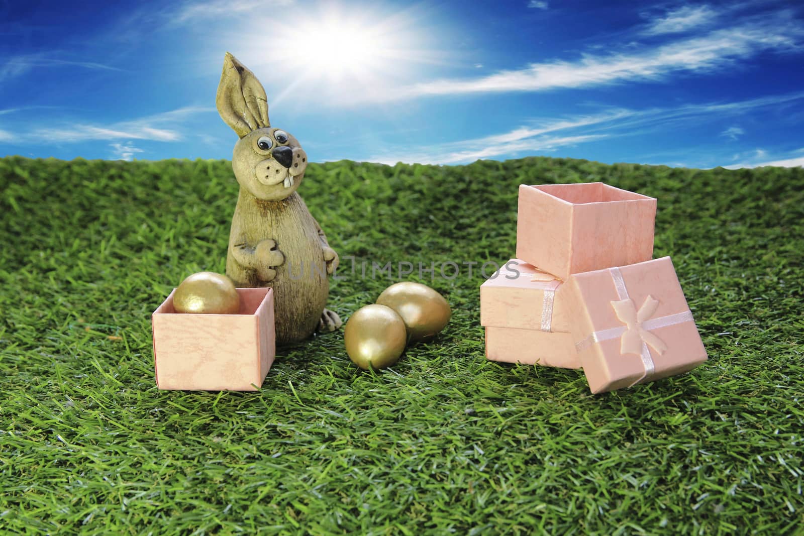 Easter. Brown Easter Bunny with pink gift box