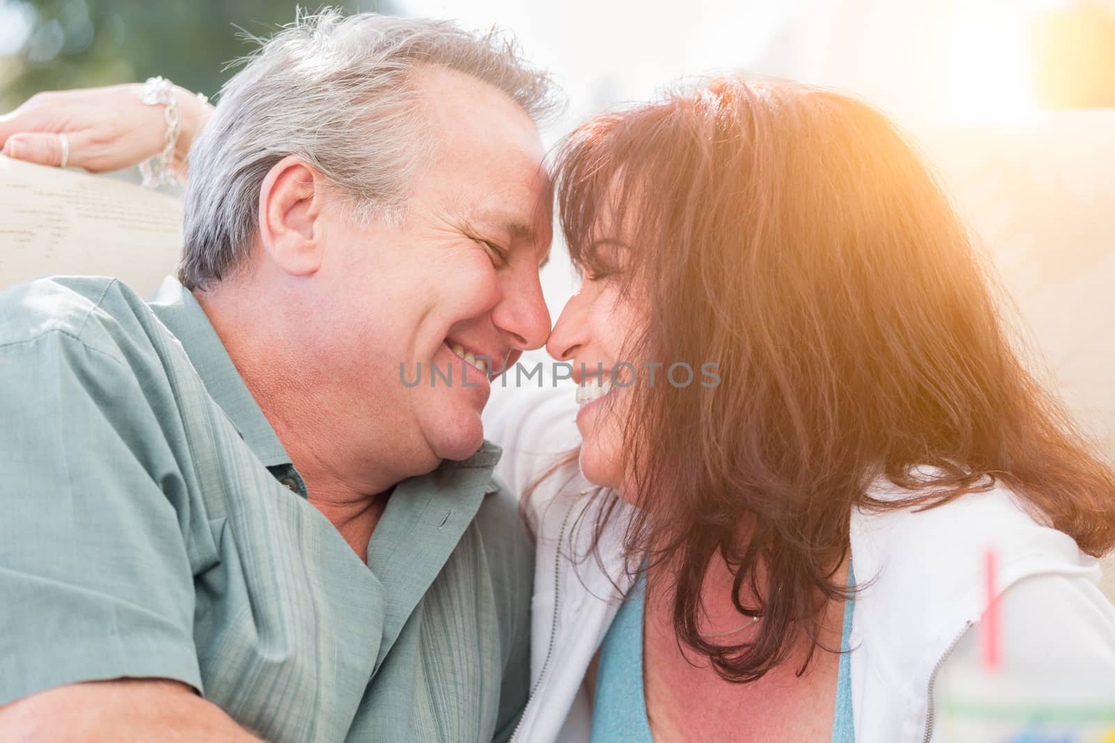 Happy Middle Aged Couple Enjoy A Romantic Moment Together Outside.