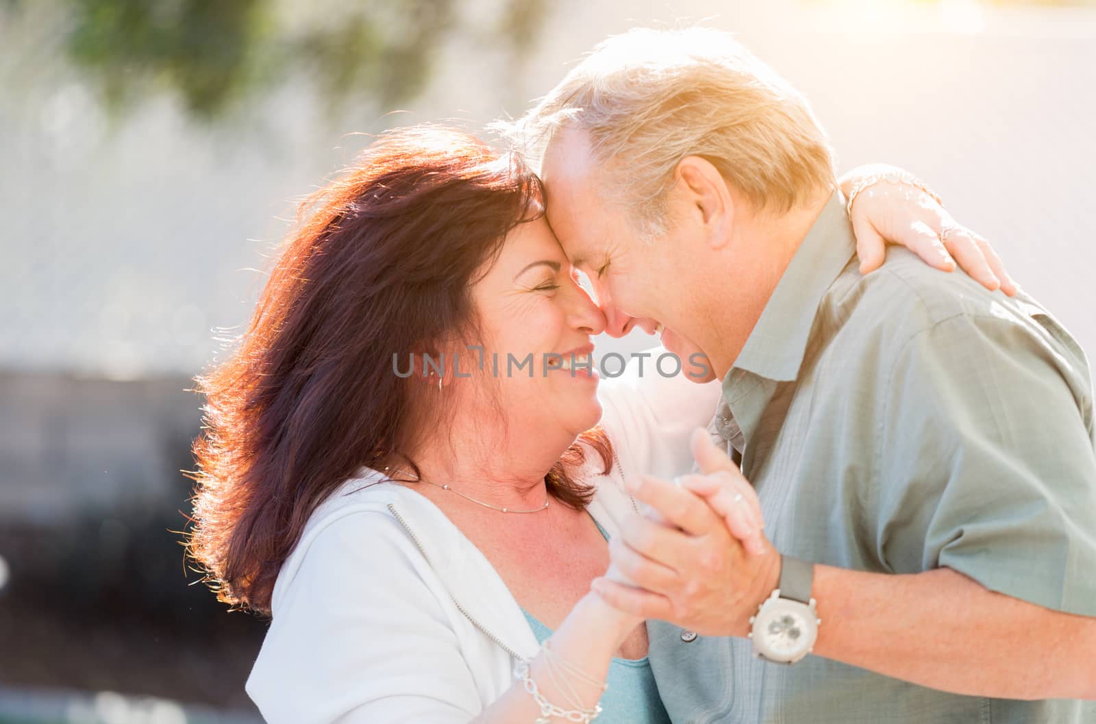 Middle Aged Couple Enjoy A Romantic Slow Dance Outside by Feverpitched