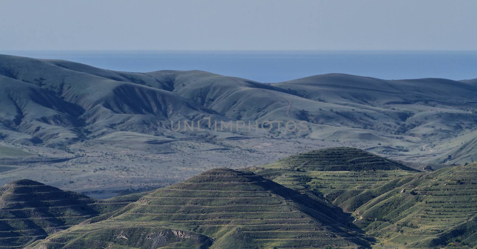 Crimean barrows on a background of mountains, sea and sky by fogen