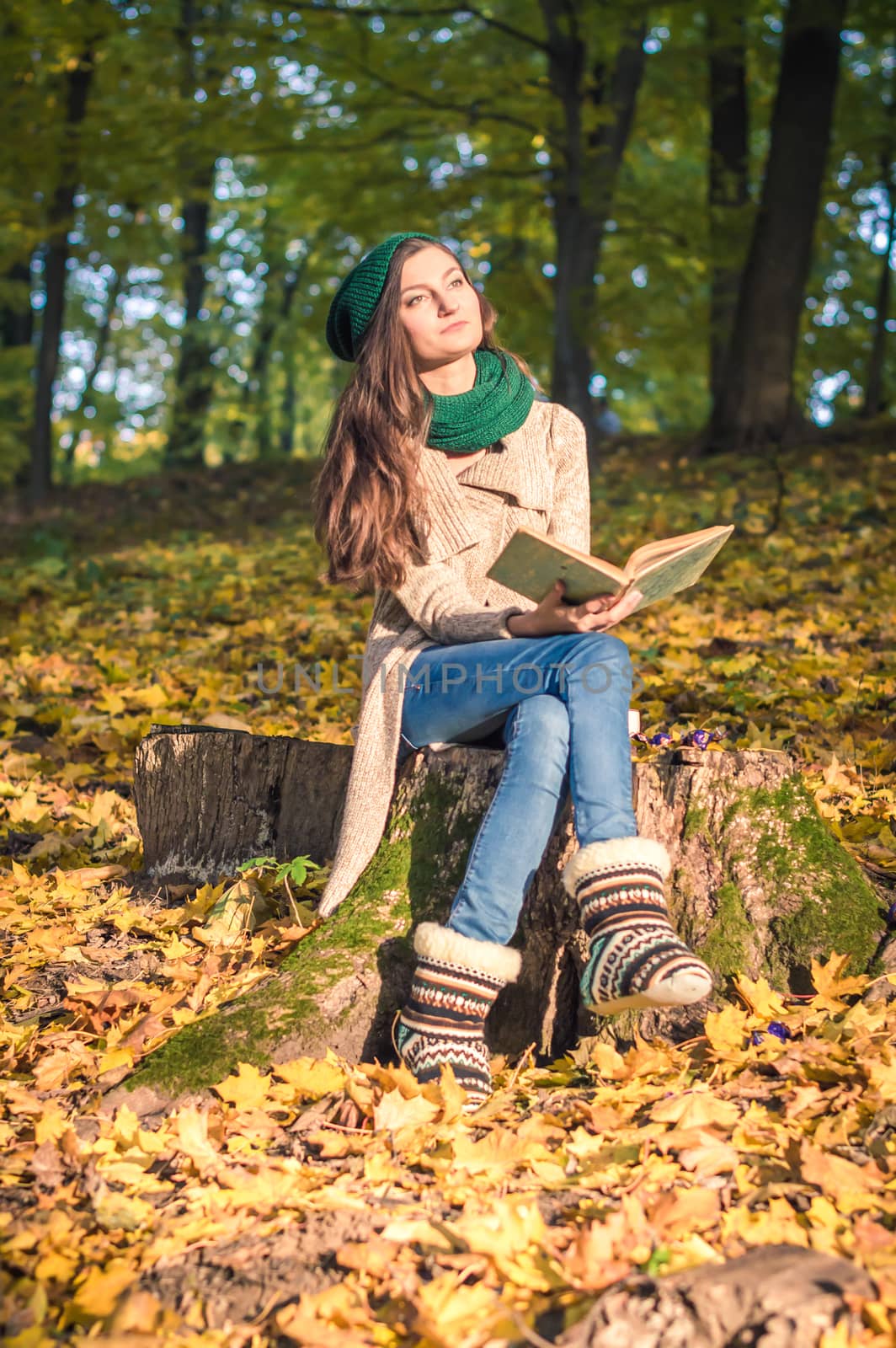 girl reading a book in the Park by okskukuruza