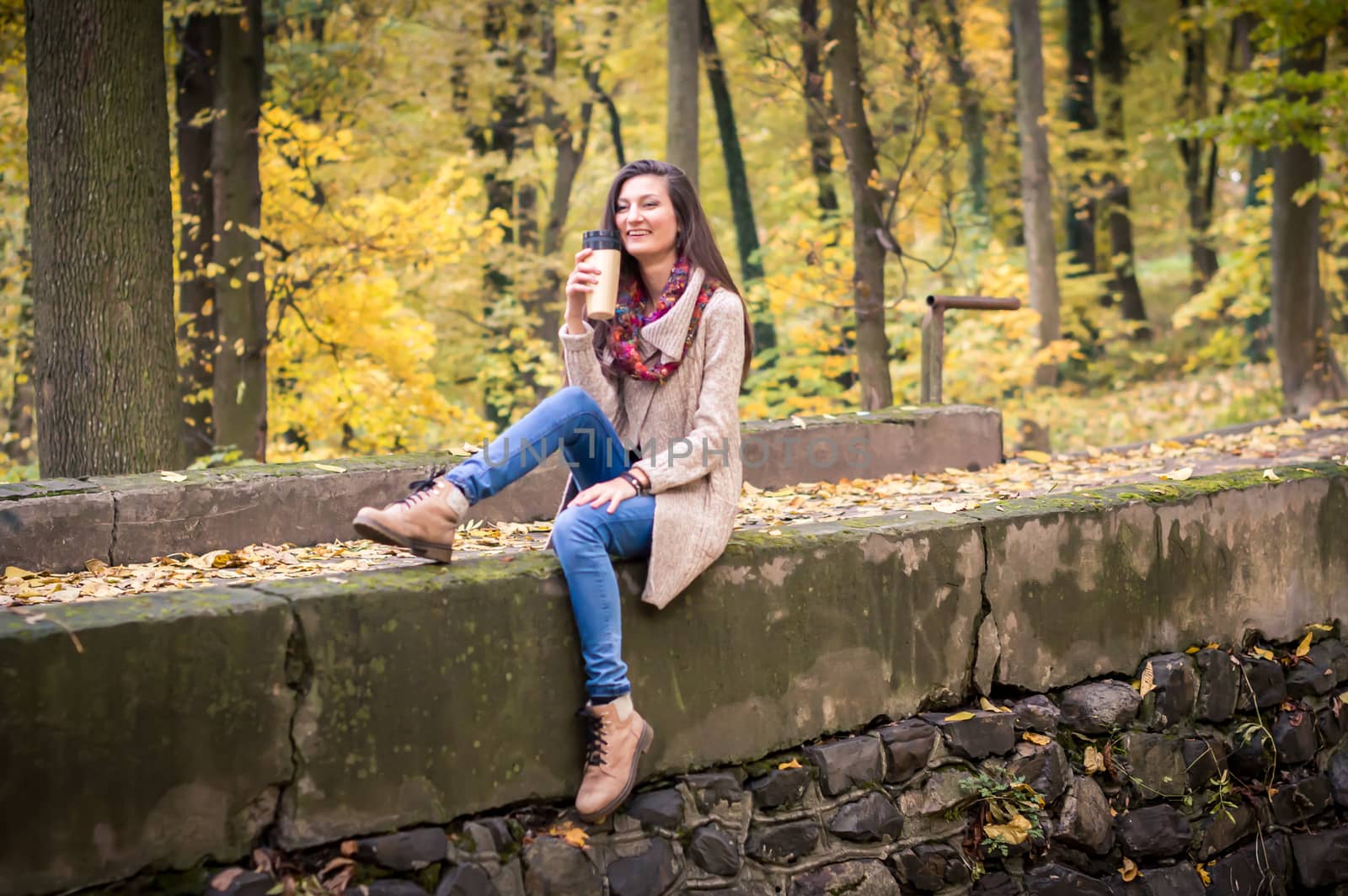 girl sitting on the concrete stone in the Park