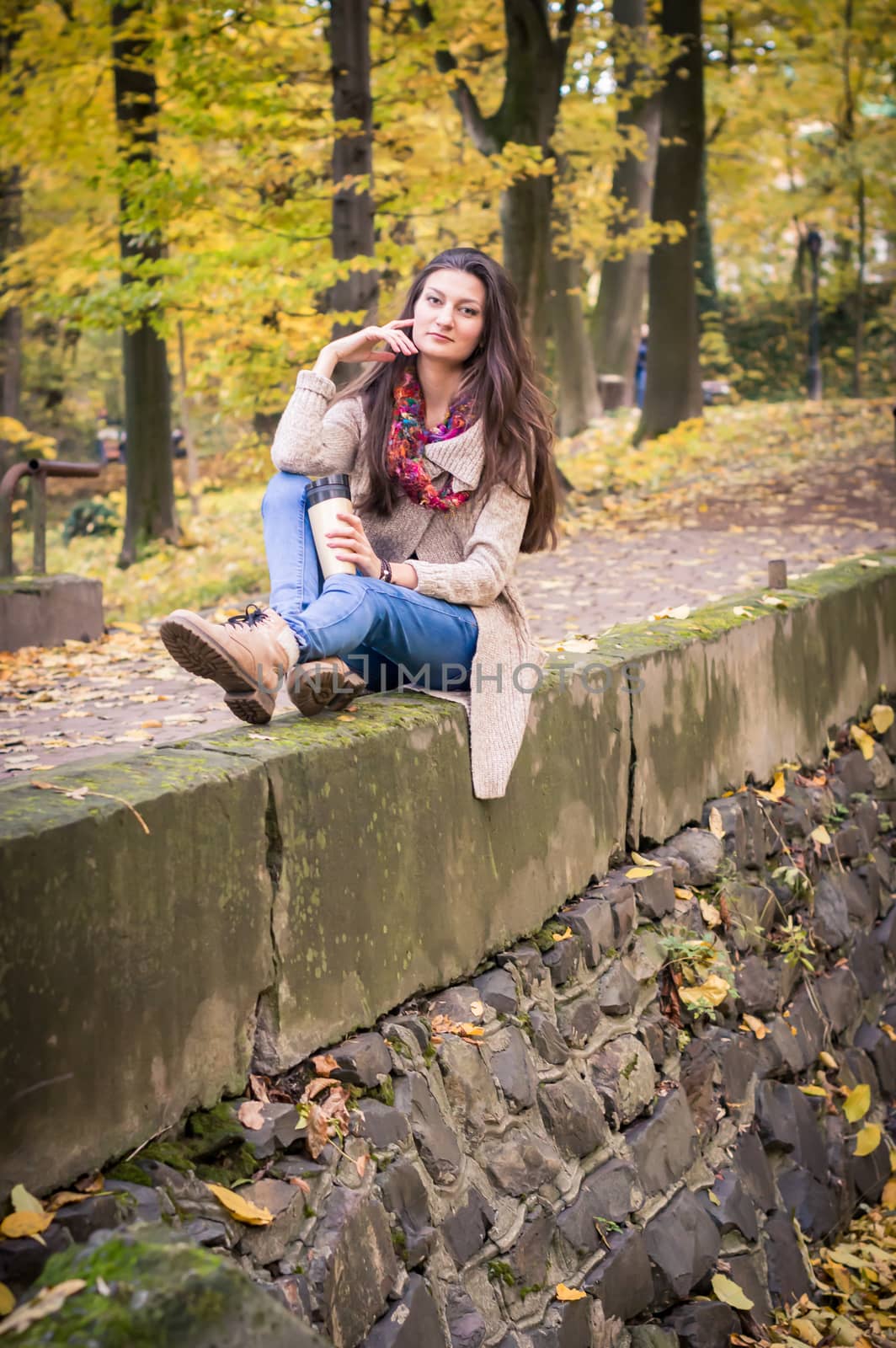 girl sitting on the concrete stone in the Park