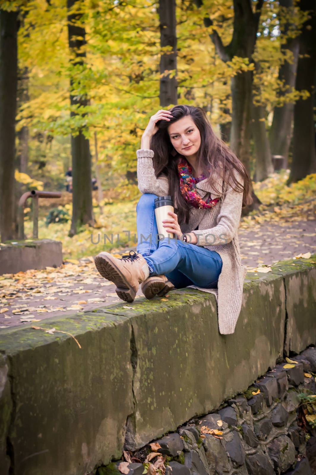 girl sitting on the concrete stone in the Park