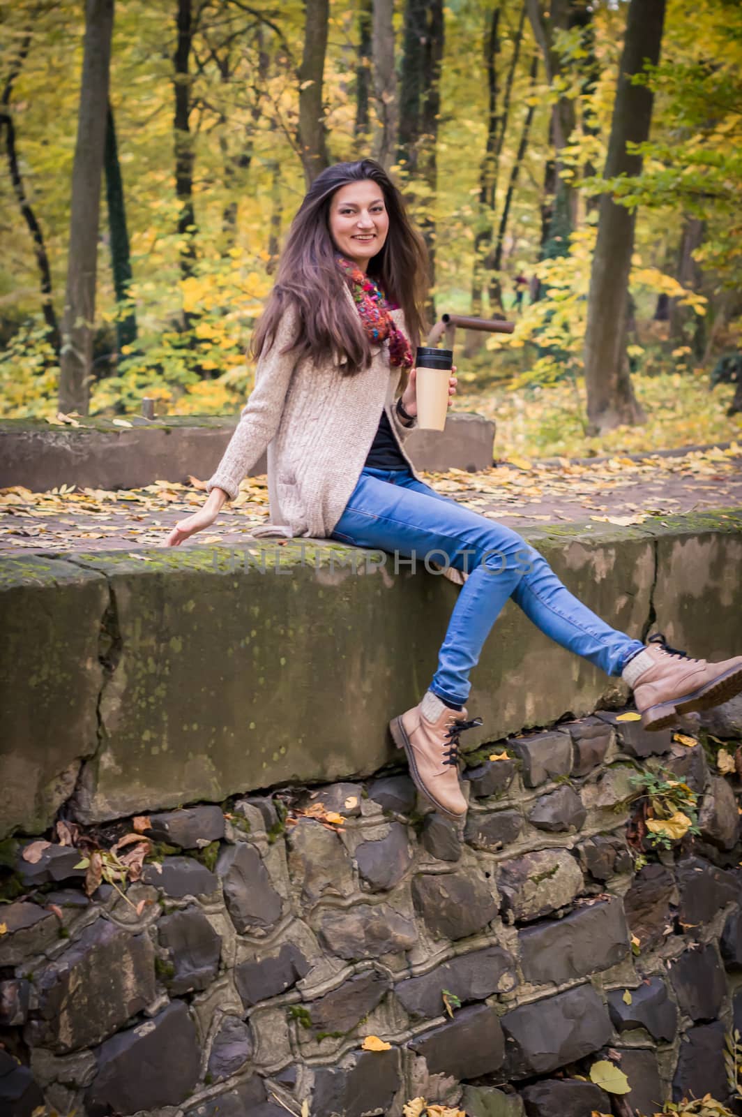 girl sitting on the stone by okskukuruza