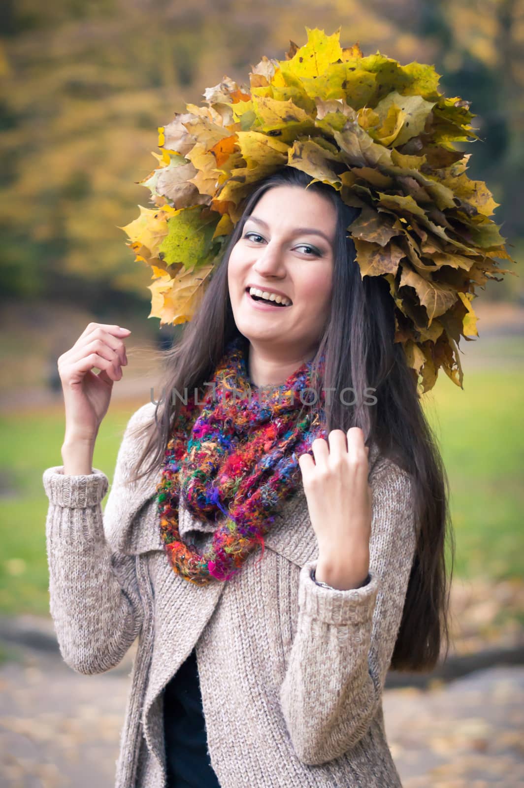 girl with a wreath of leaves in autumn Park