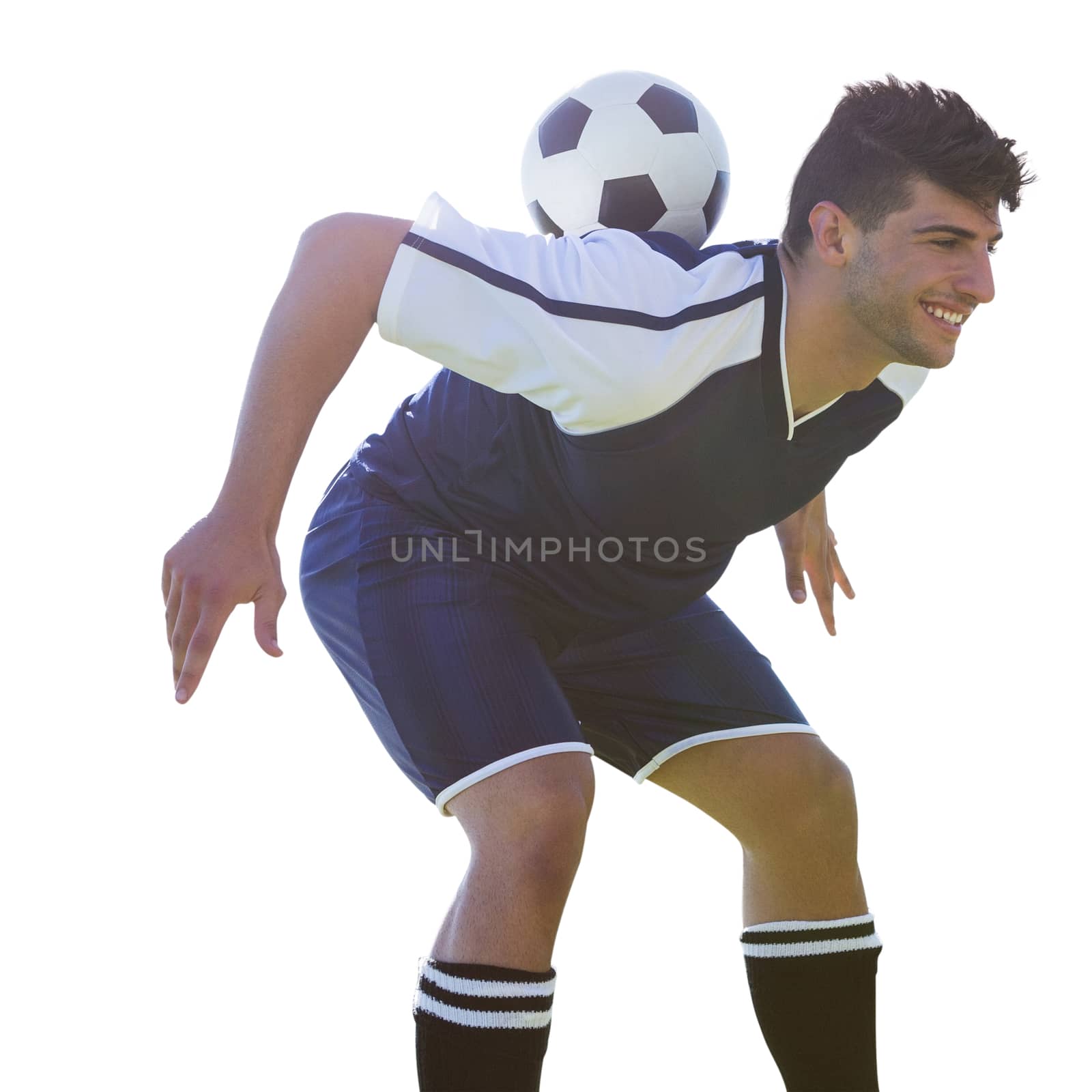 Man soccer player keeping the ball on his back on a white background