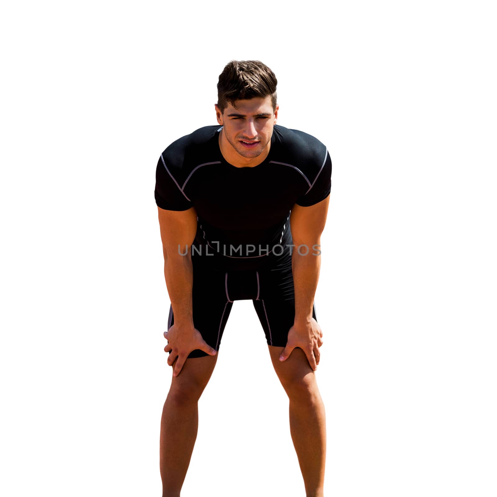 Sportsman posing his hands on knee in a white background