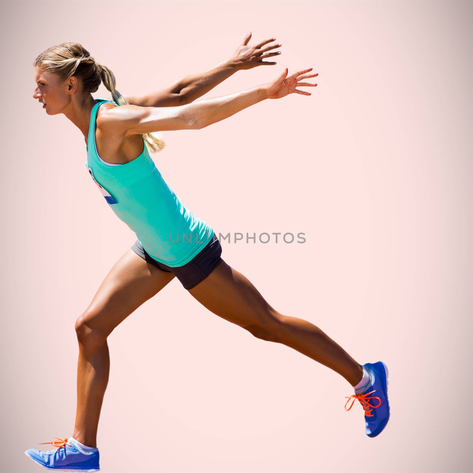 Sportswoman finishing her run against beige background