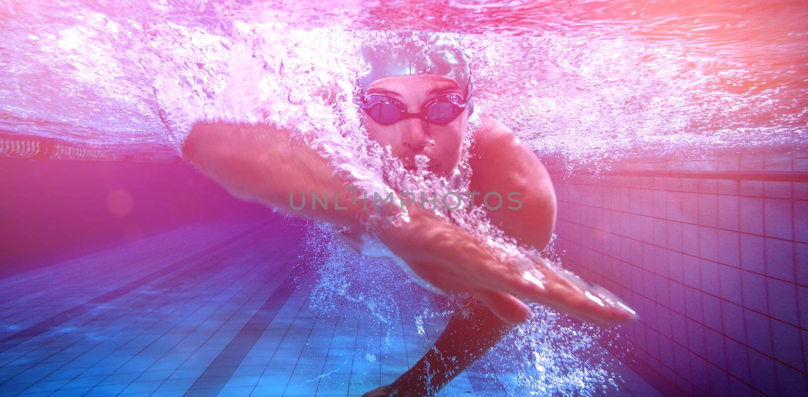 Fit swimmer training by himself in the swimming pool at the leisure centre