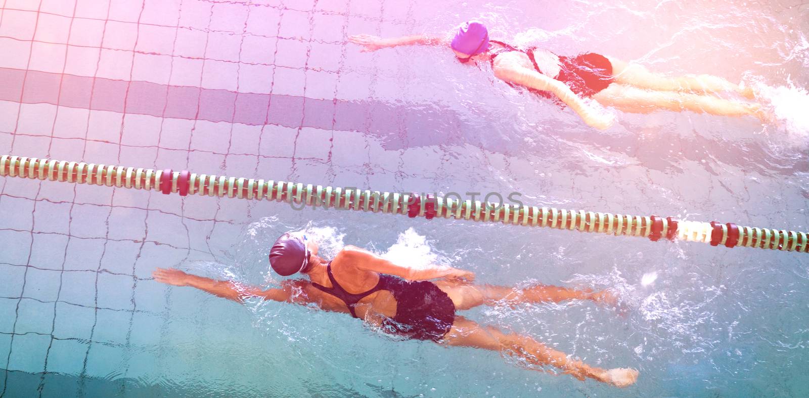 Female swimmers racing in the swimming pool at the leisure center