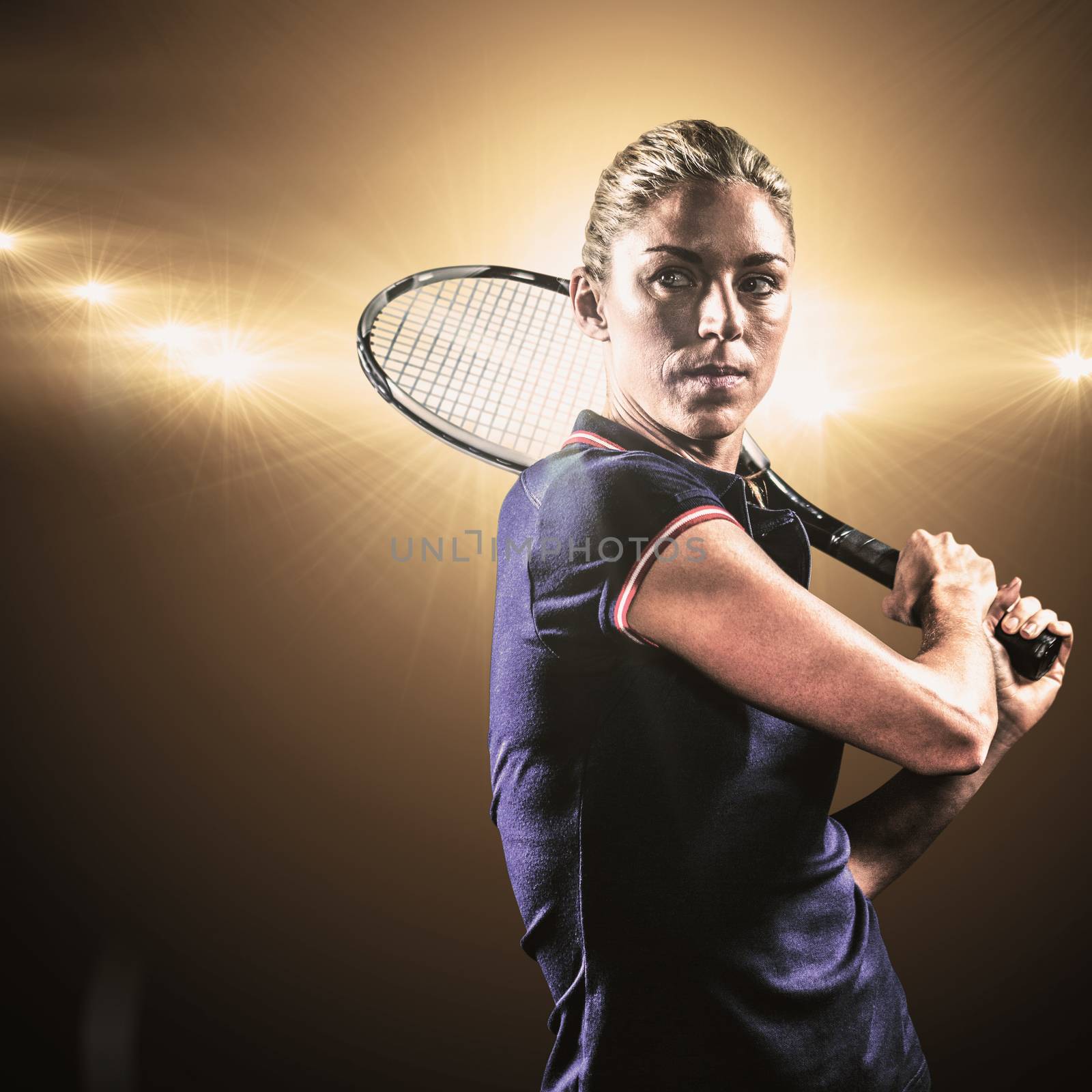 Tennis player playing tennis with a racket against spotlight