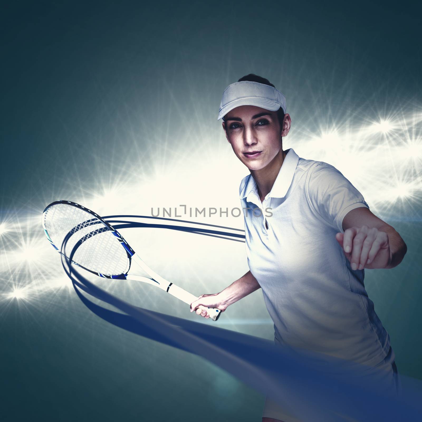 Female athlete playing tennis against spotlight