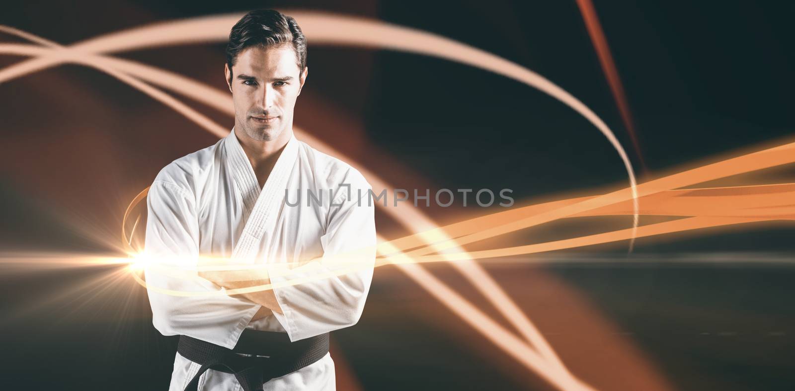 Composite image of portrait of fighter standing on black background by Wavebreakmedia