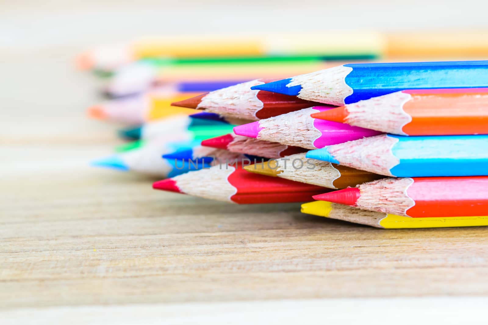 colorful pencils on the wooden table