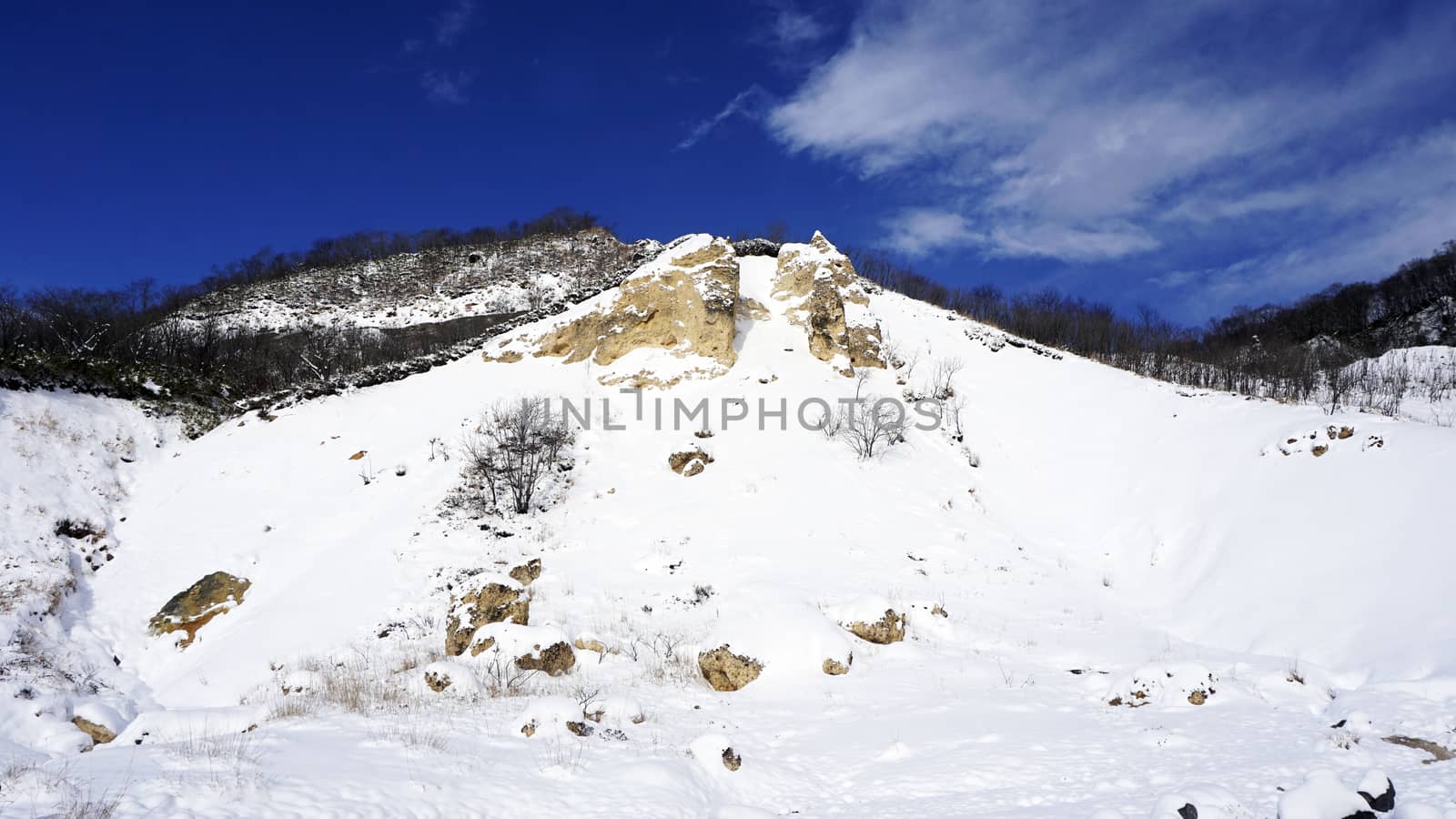 Noboribetsu onsen snow mountain bluesky hell valley winter national park in Jigokudani, Hokkaido, Japan
