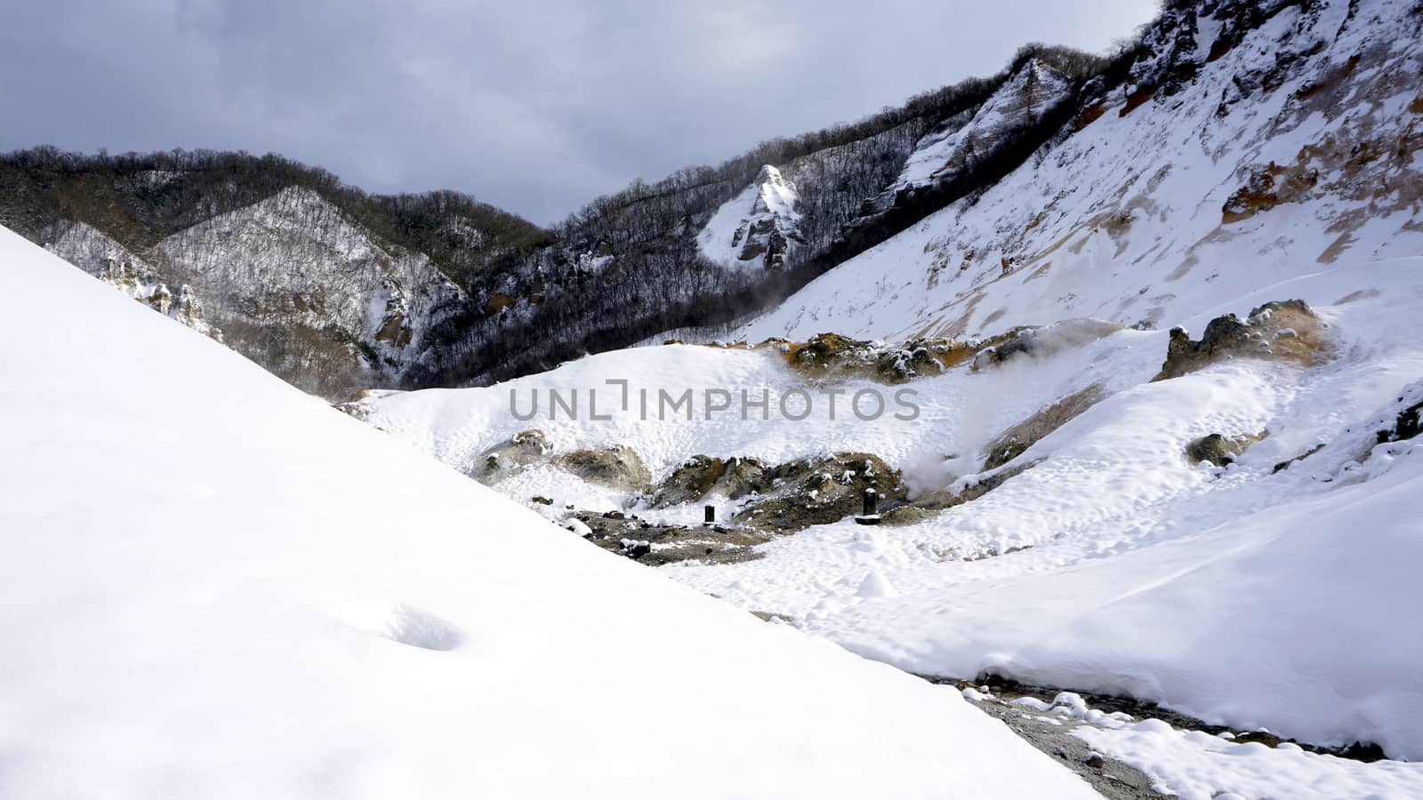 Noboribetsu onsen hell valley snow white mountain winter national park in Jigokudani, Hokkaido, Japan