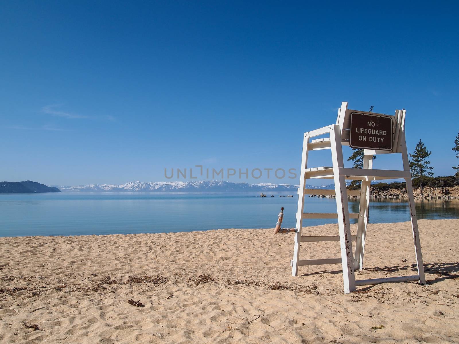 lifeguard chair stand on the shore of lake Tahoe. 