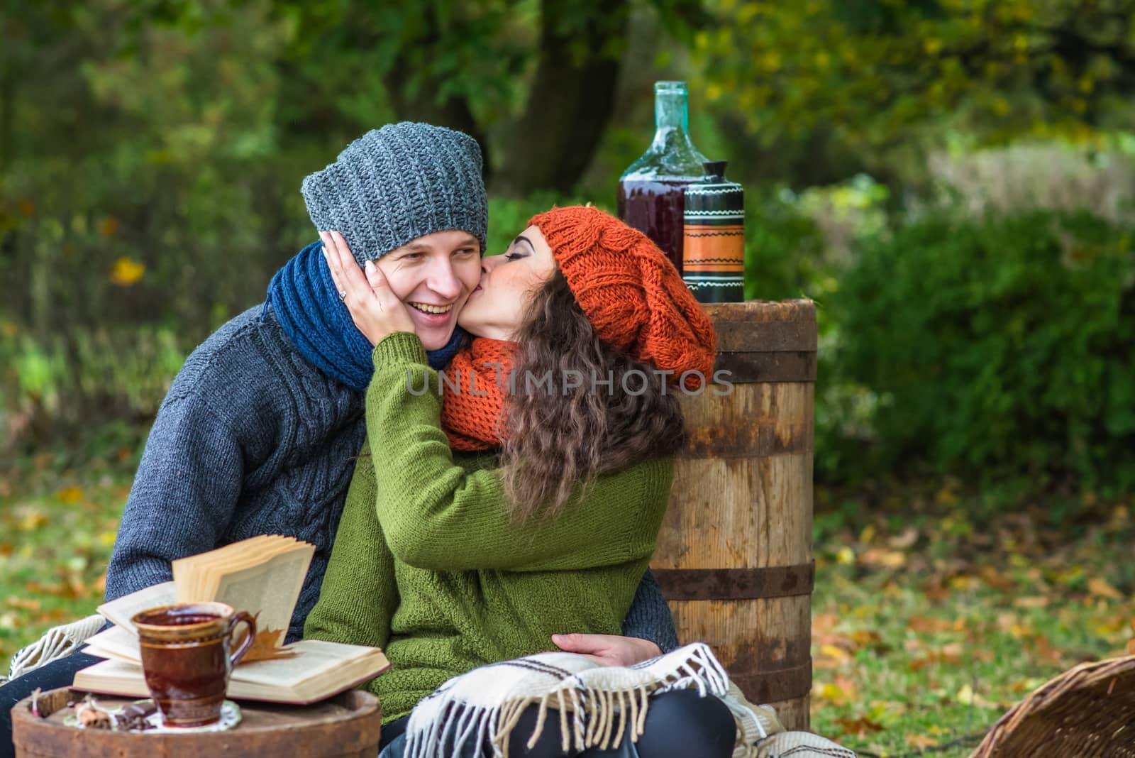 loving couple in autumn garden by okskukuruza