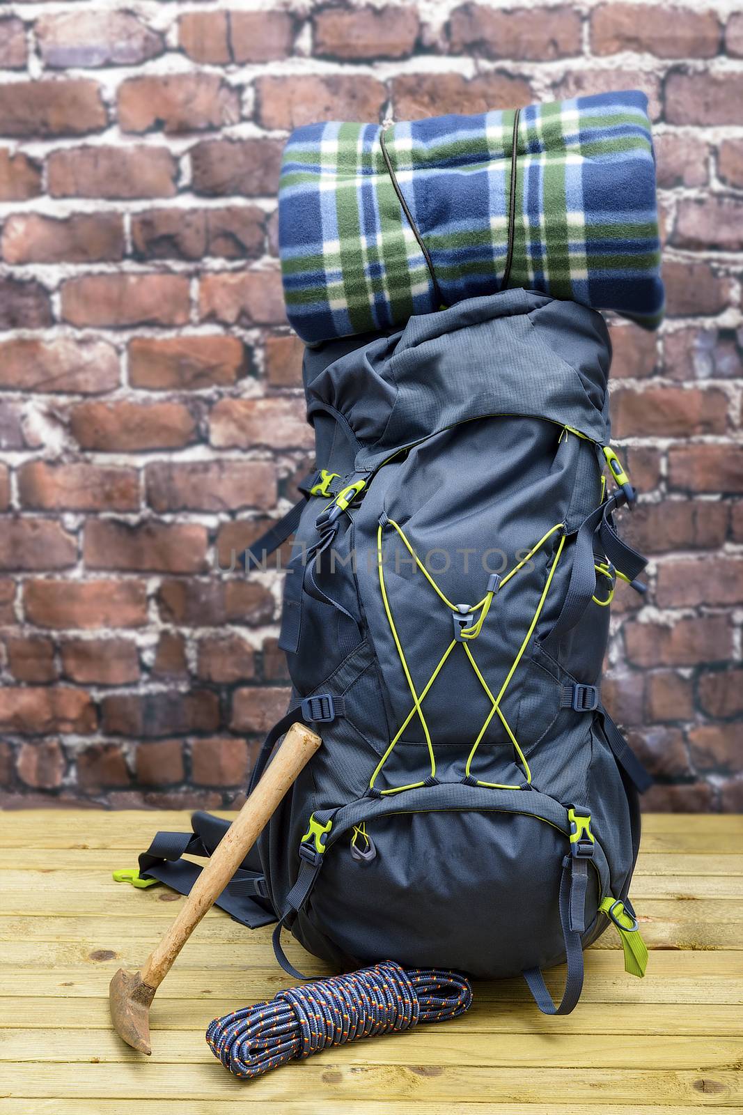 Hiking equipment, rucksack, boots and backpack. Concept for family hiking. Colorful background.