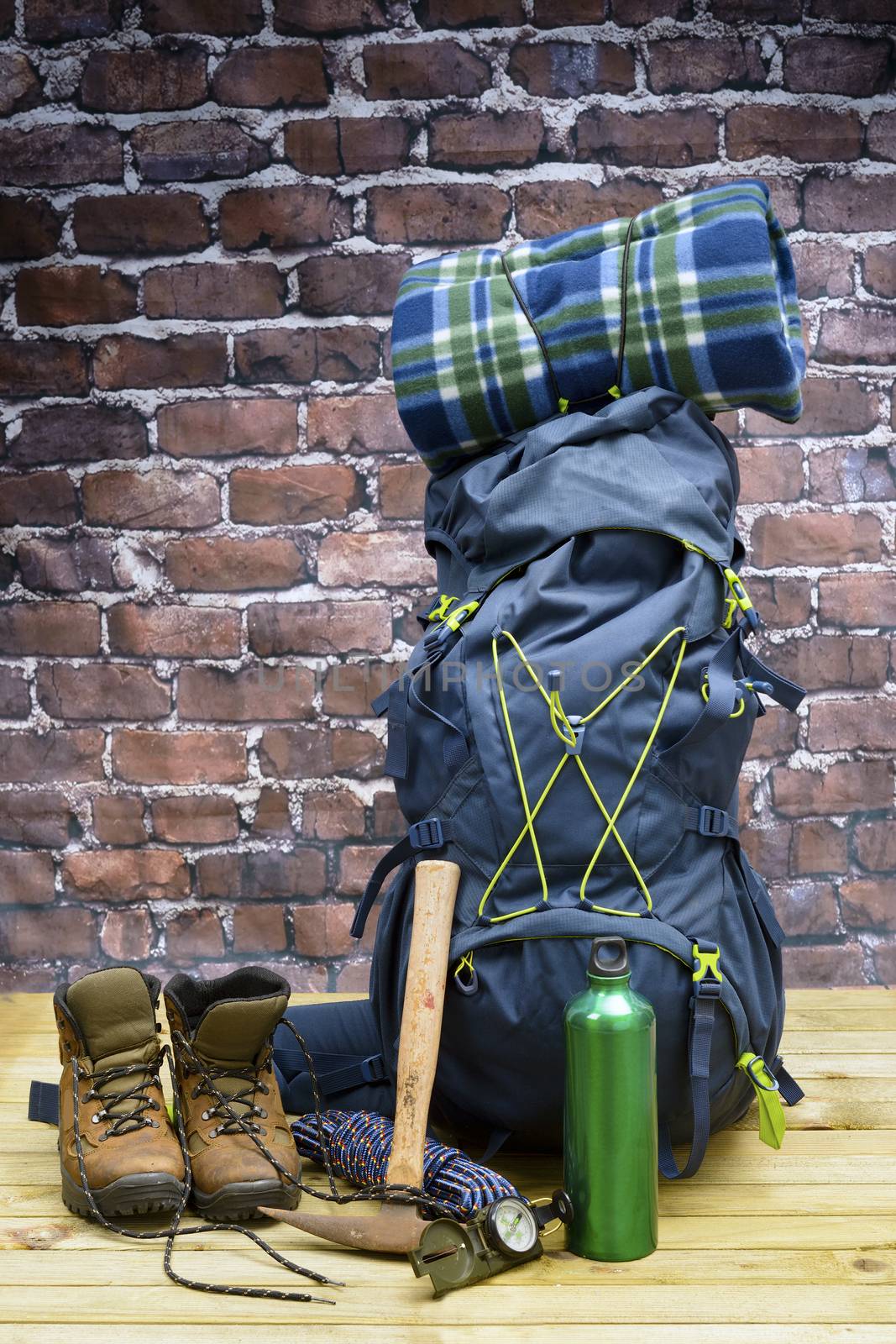 Hiking equipment, rucksack, boots and backpack. Concept for family hiking. Colorful background.