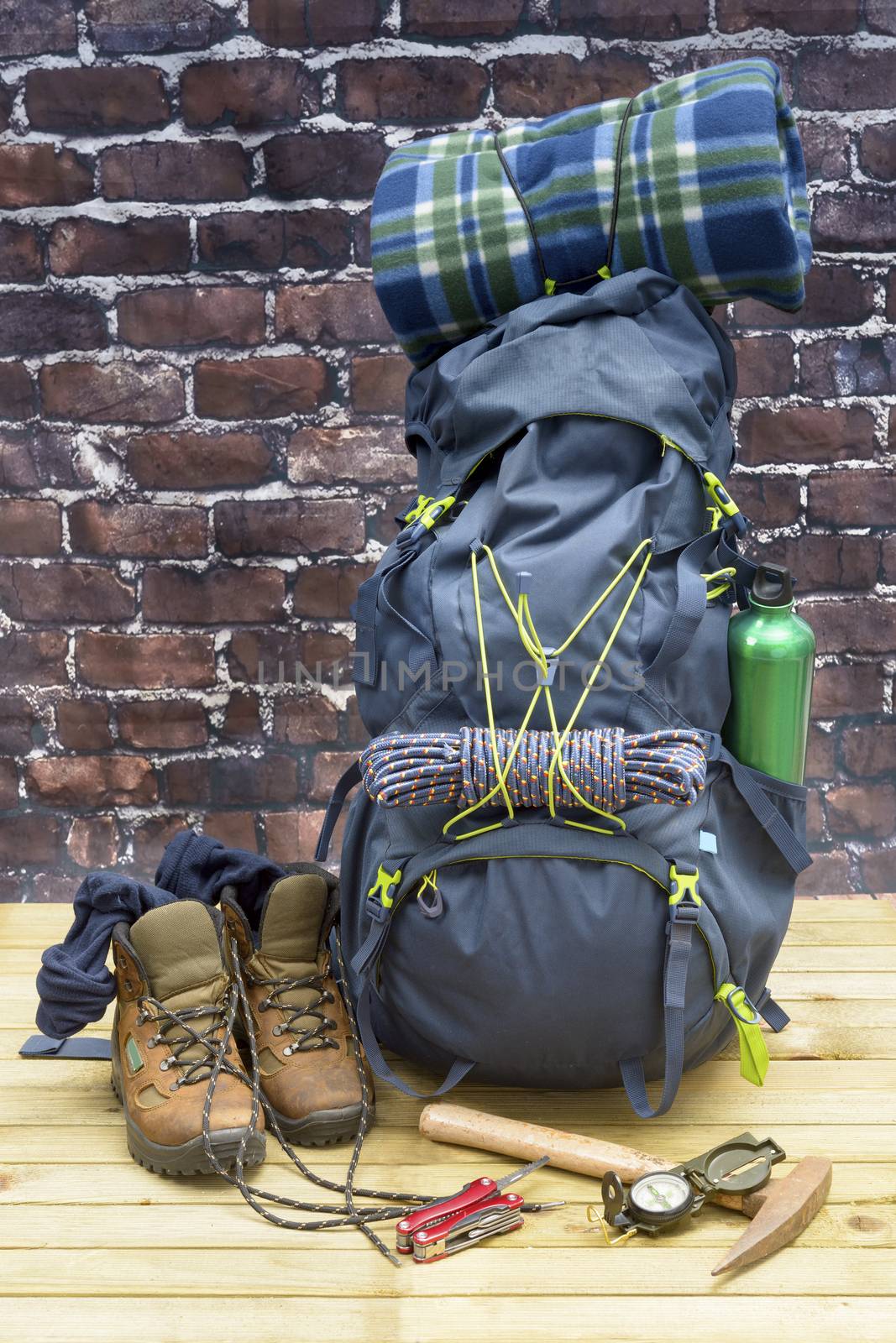 Hiking equipment, rucksack, boots and backpack. Concept for family hiking. Colorful background.