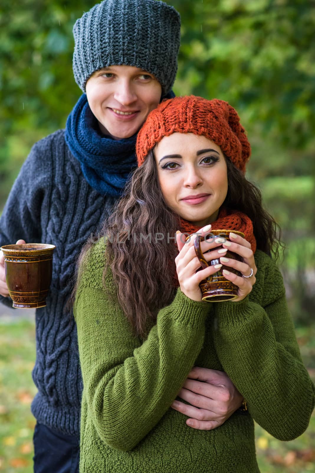young couple with cup of coffee by okskukuruza
