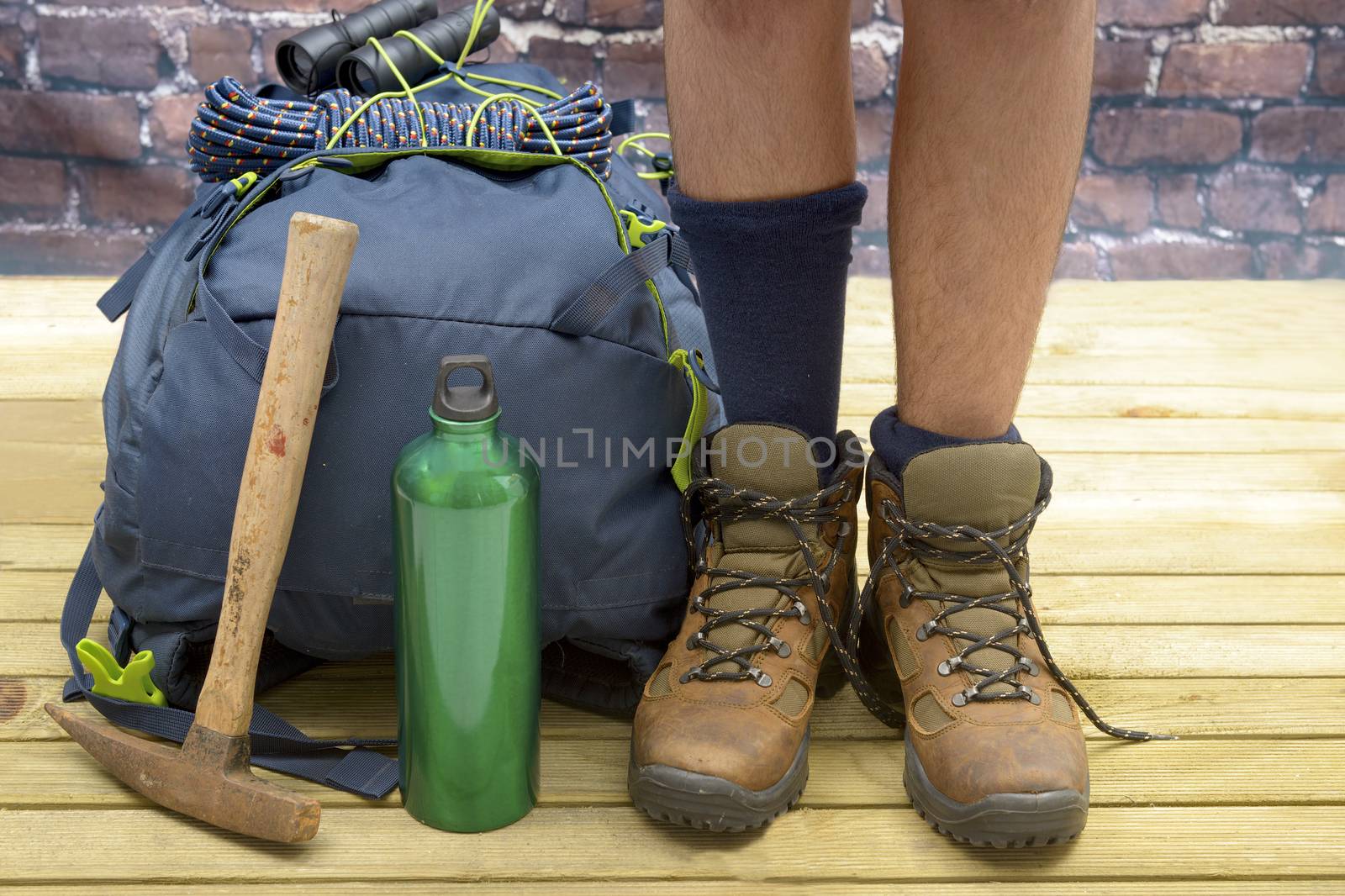 Hiking equipment, rucksack, boots and backpack. Concept for family hiking. Colorful background.