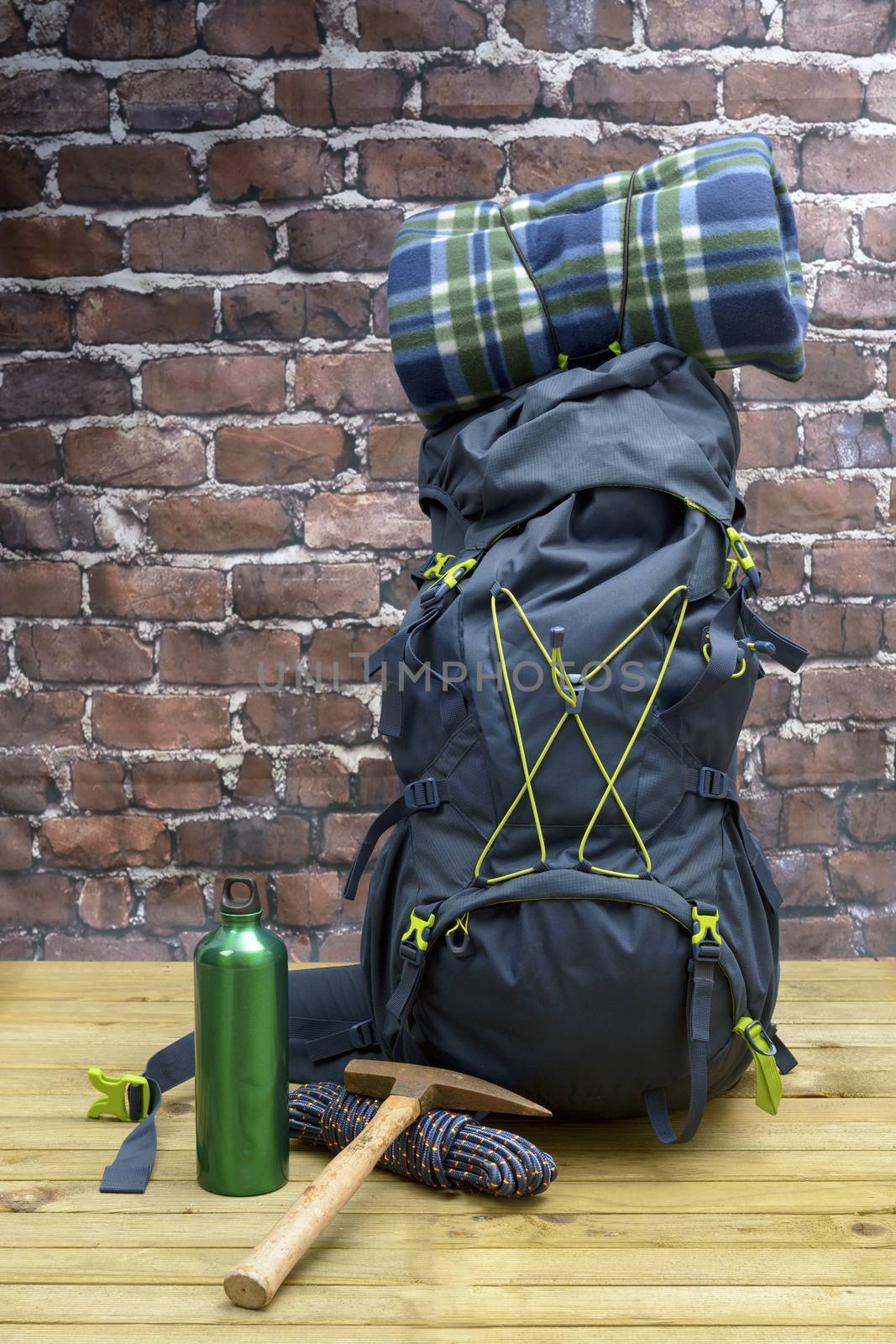 Hiking equipment, rucksack, boots and backpack. Concept for family hiking. Colorful background.