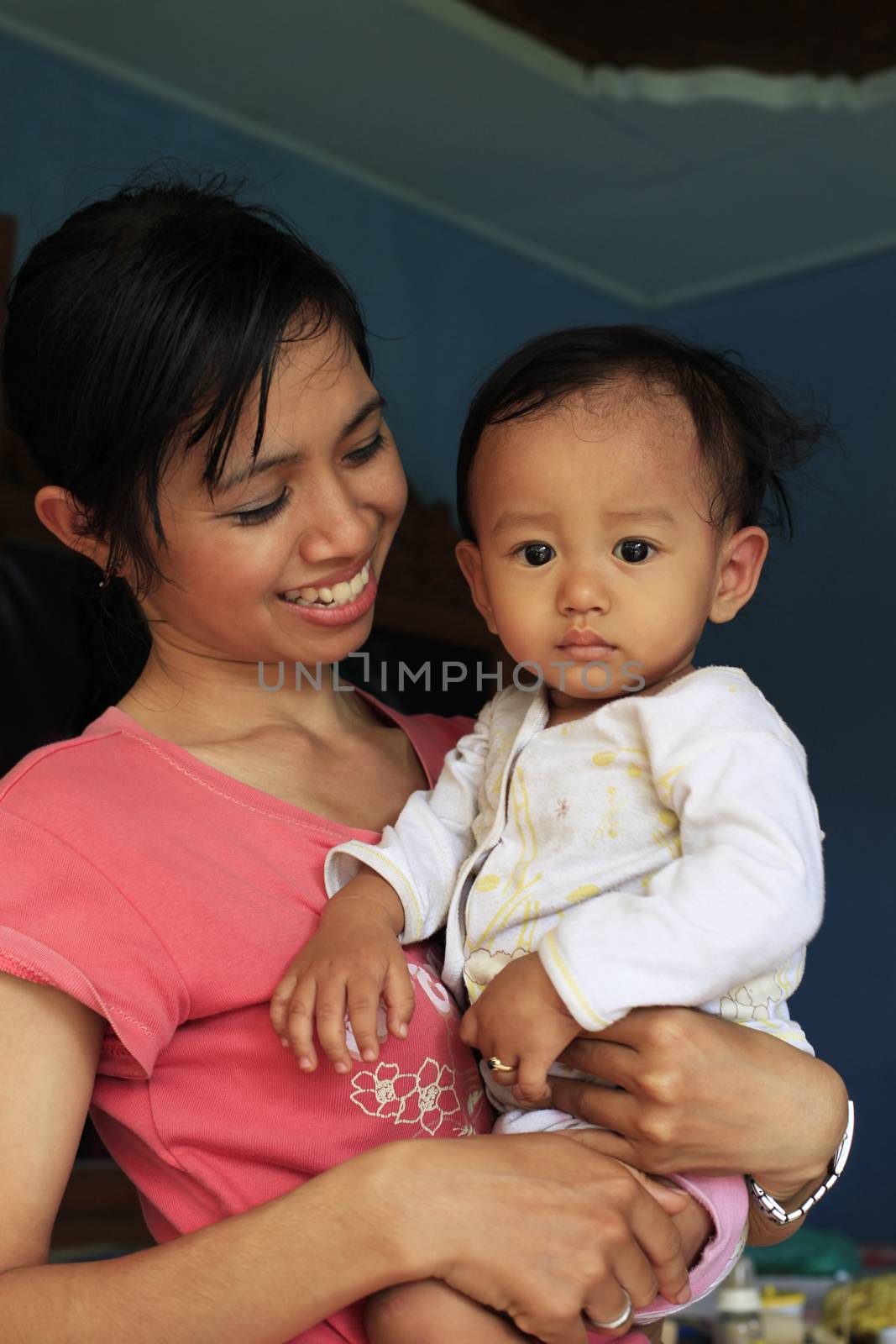 Young happy asian mother and her son