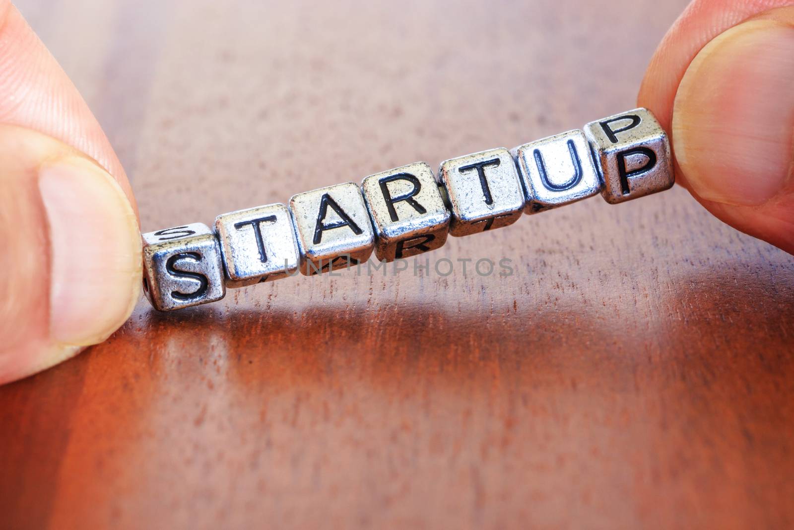 Start up business finance concept with metal letters