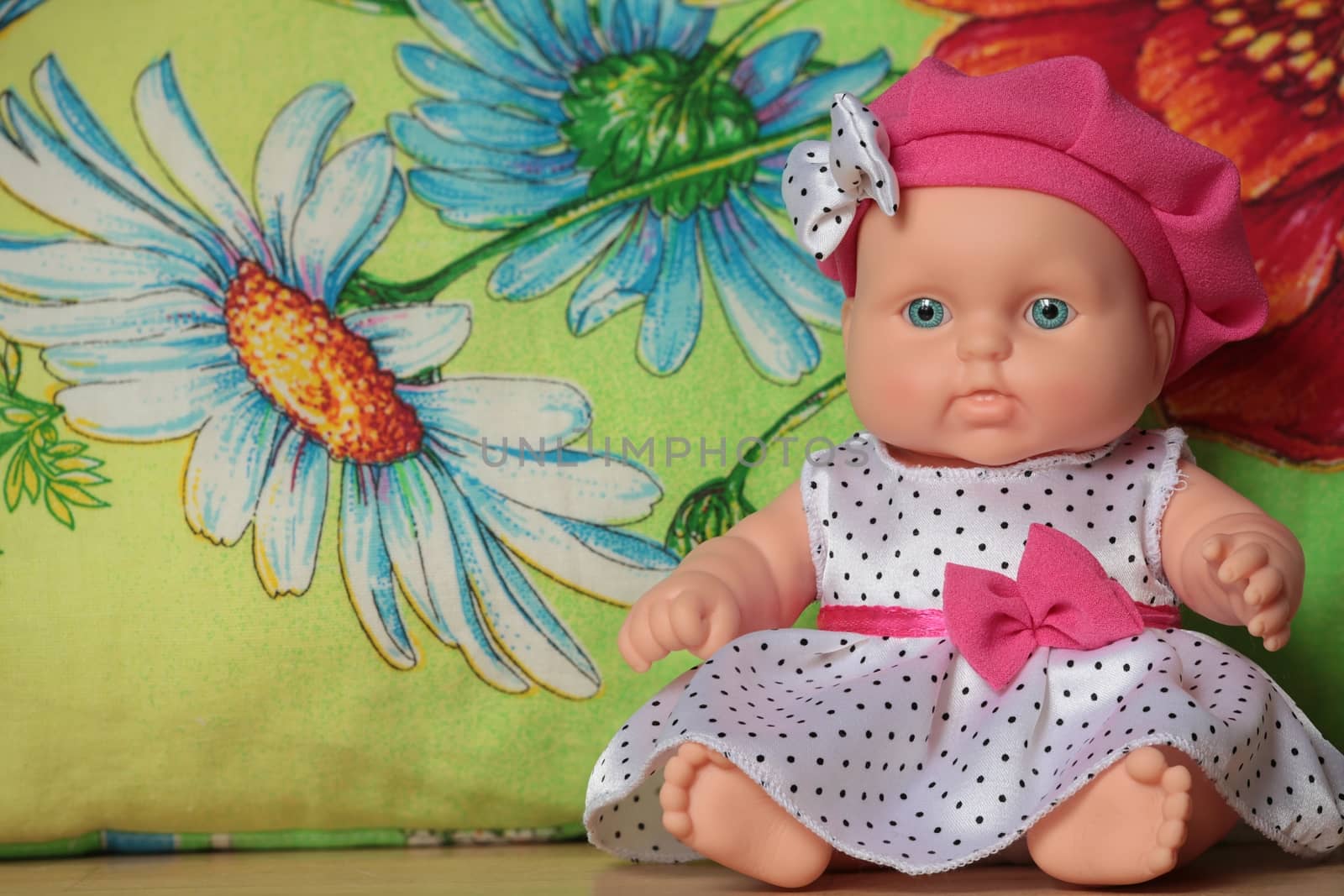 baby doll sitting on a flower background