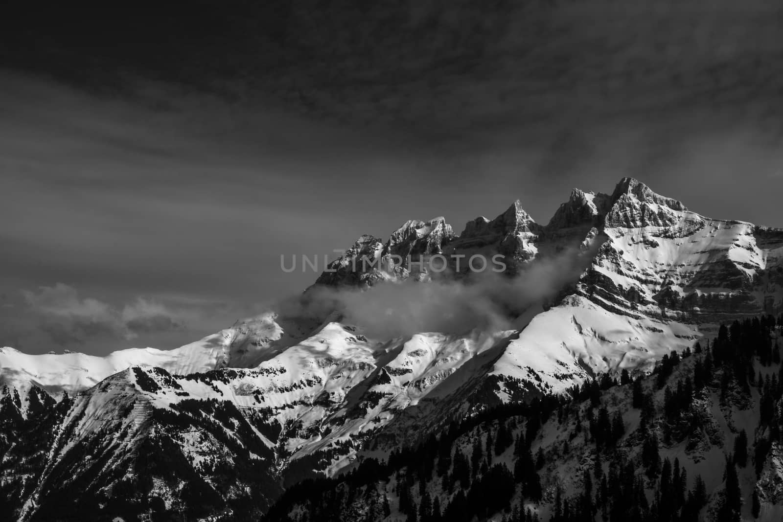 The Dent du midi in winter with snow and clouds