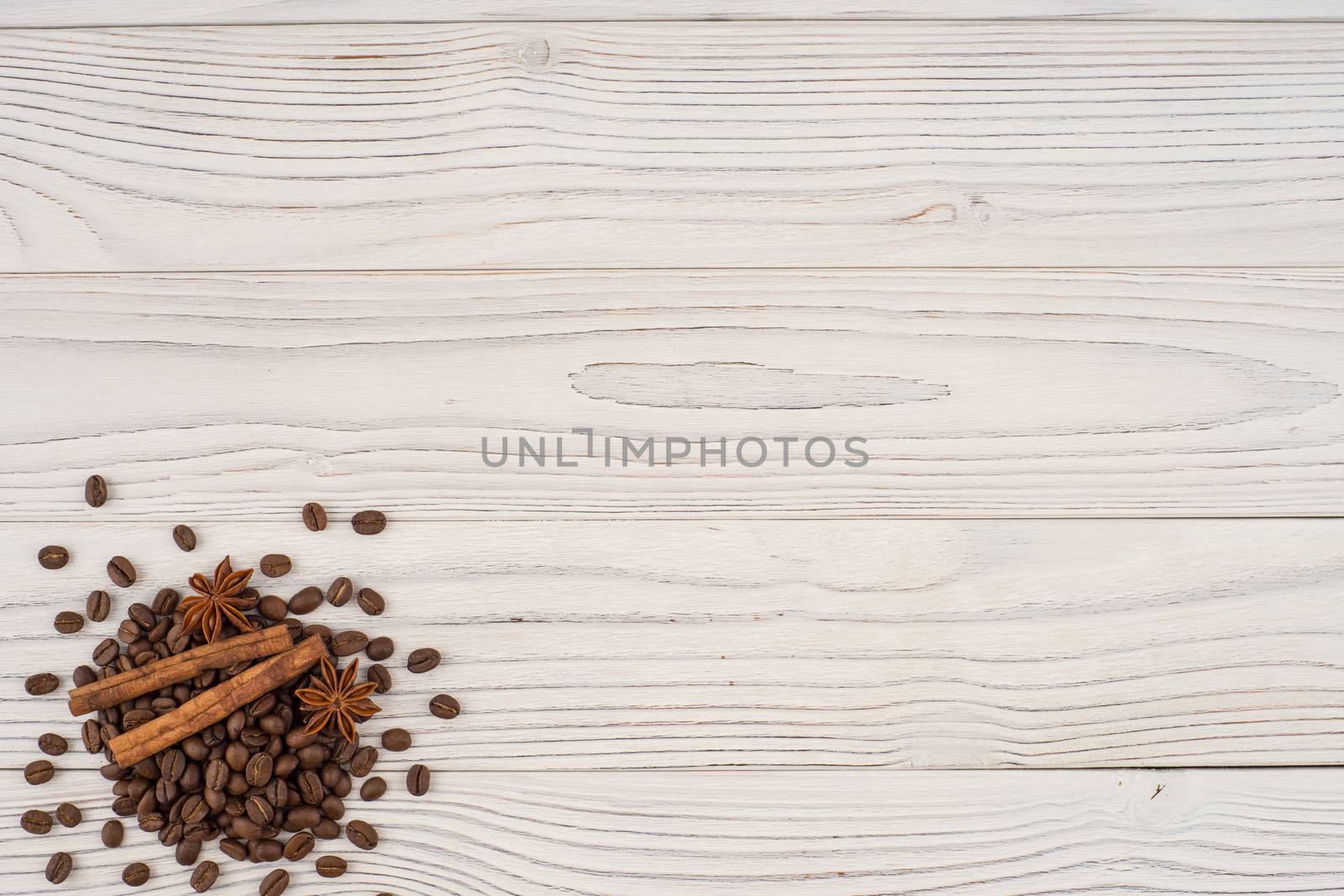 Coffee with cinnamon on old wooden table.  by DGolbay
