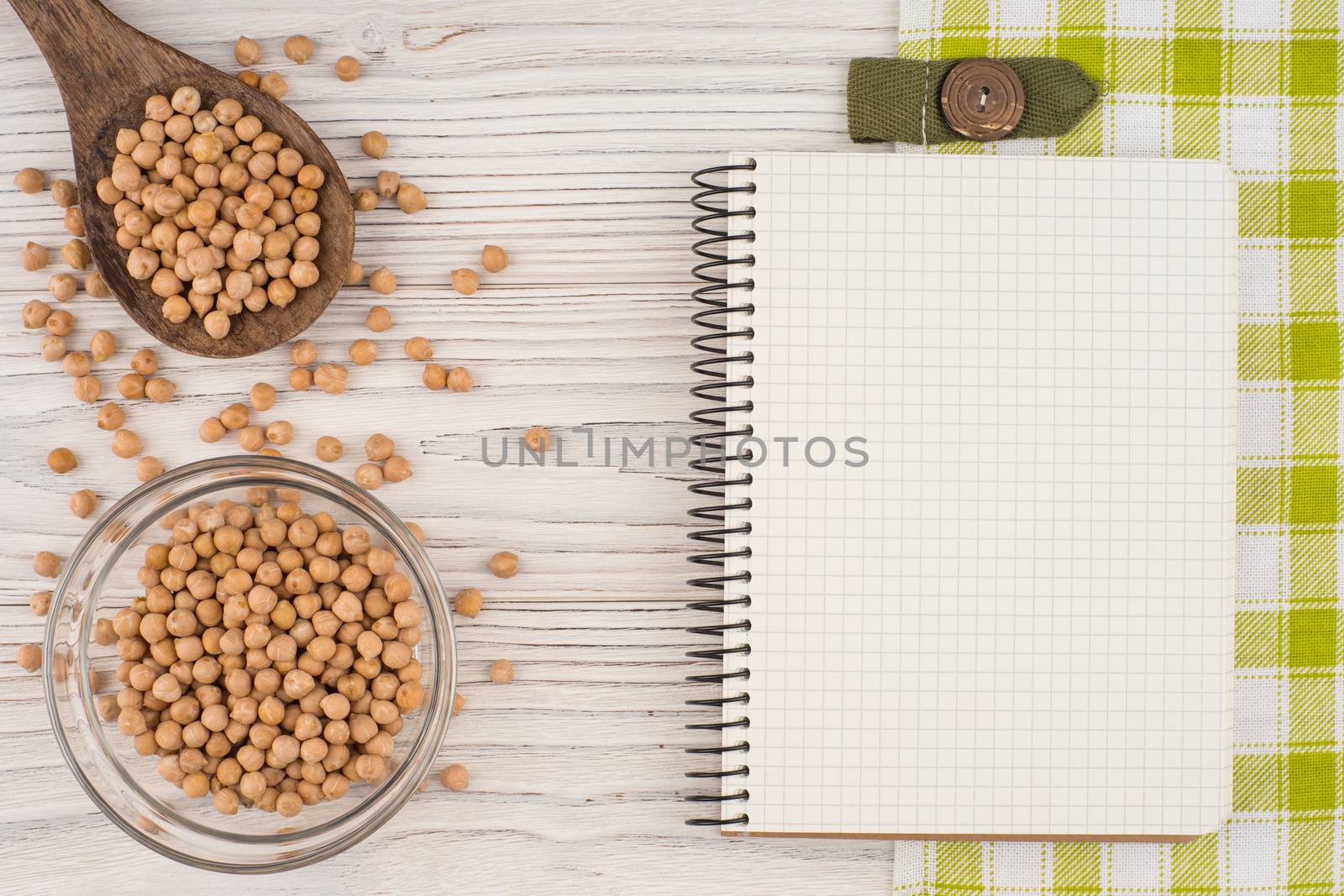 Chickpeas on old wooden table.  by DGolbay